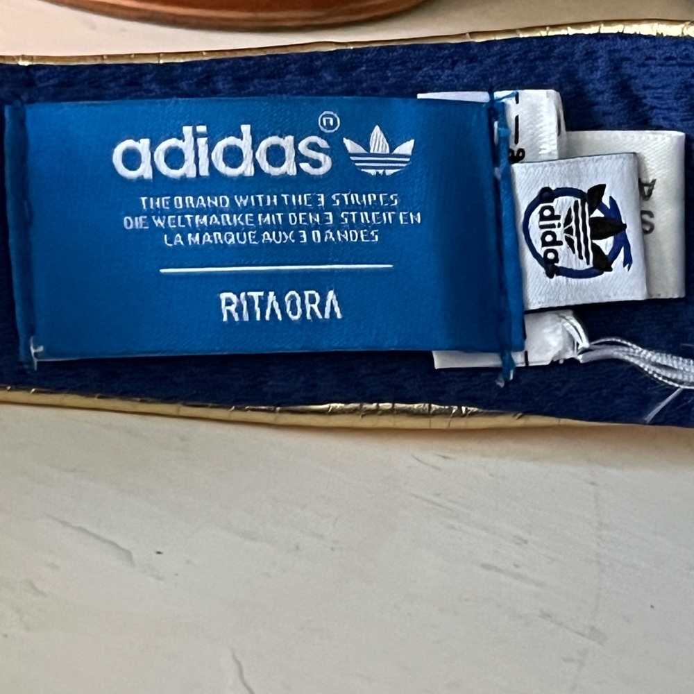 Women's Adidas Originals X Rita Ora Comic Visor Hat Superhero Superwoman Gold - Picture 2 of 2